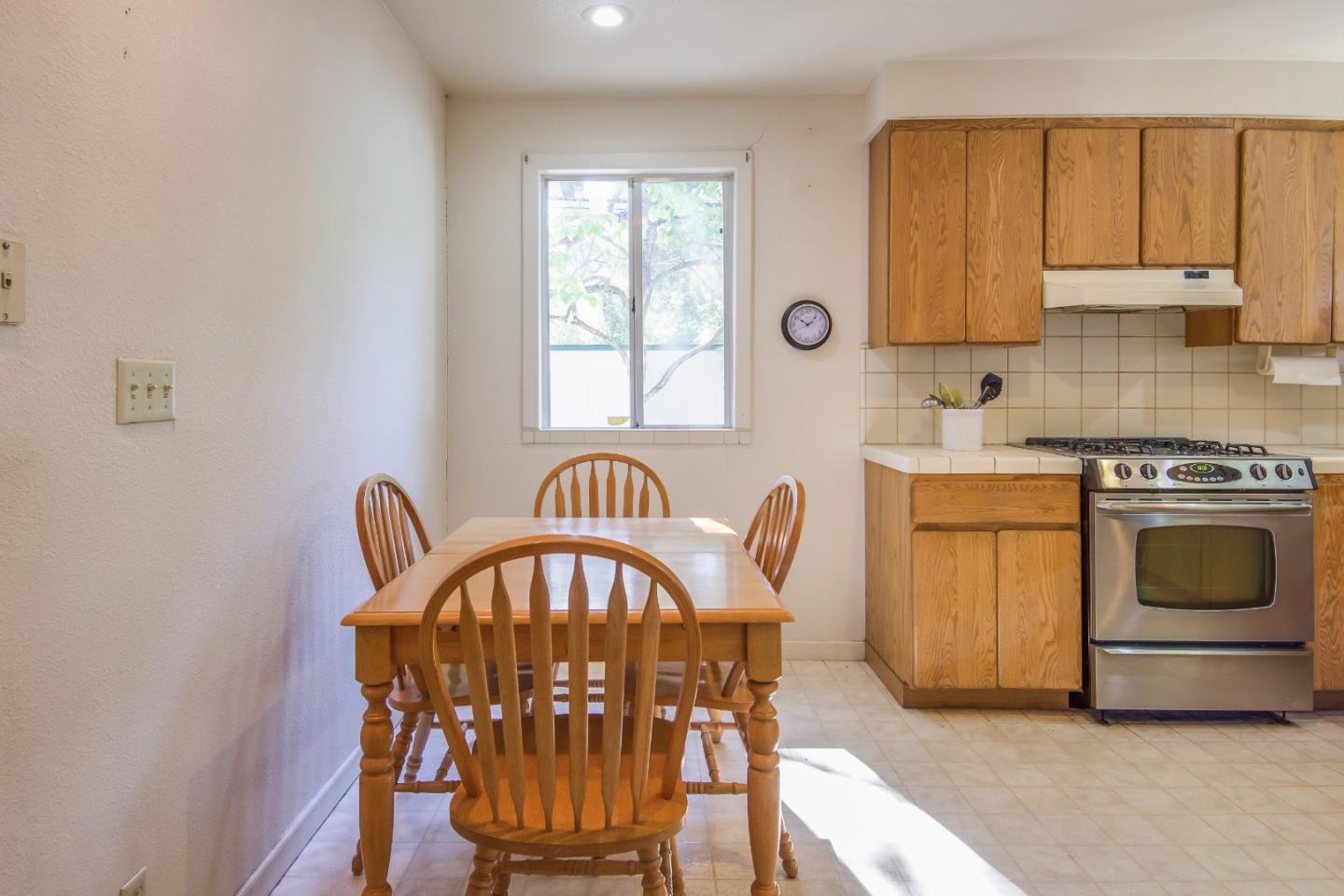 91 Marsh Road Atherton, CA 94027 - Photo 7 of 20 a kitchen with a stove a sink and a microwave