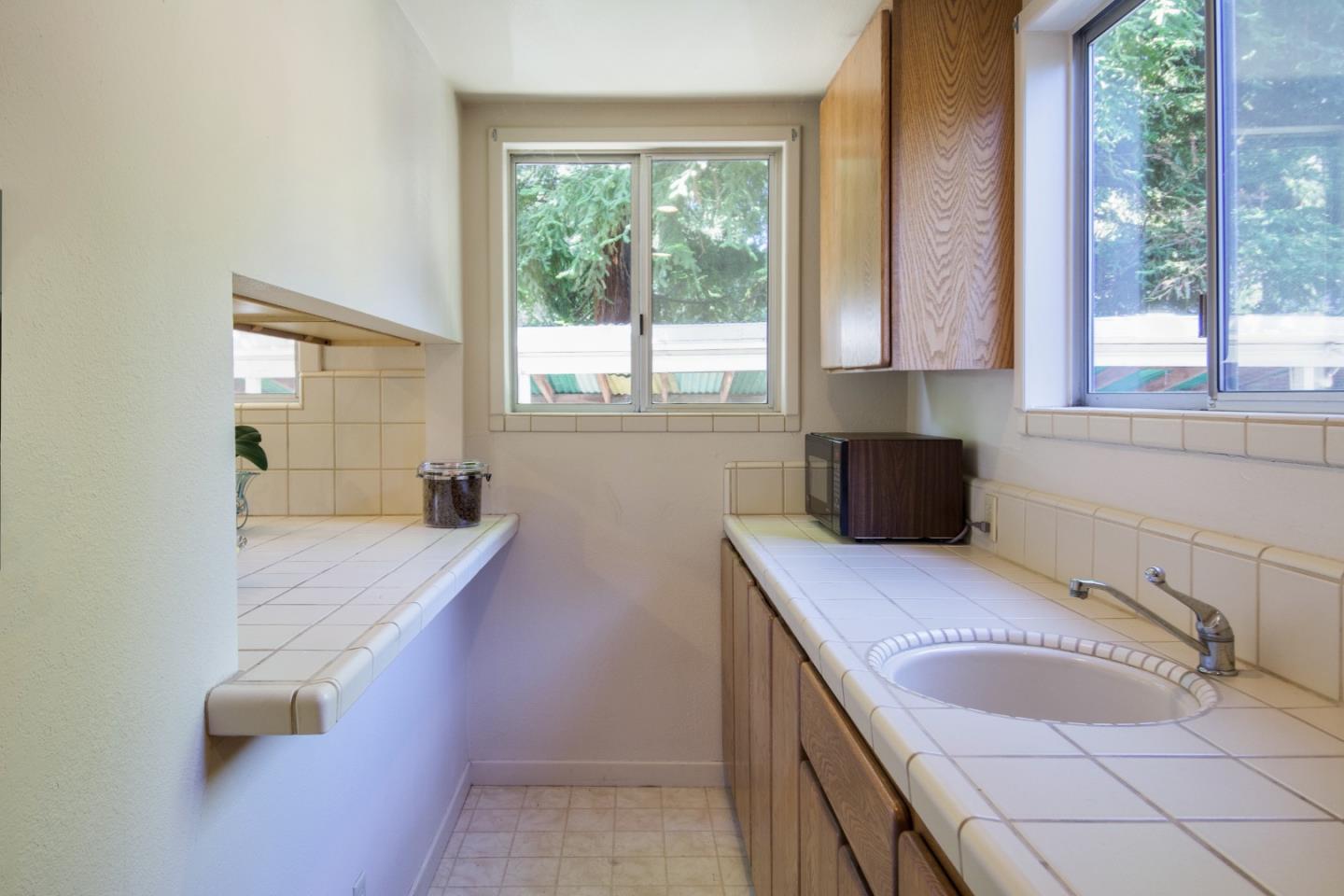 91 Marsh Road Atherton, CA 94027 - Photo 8 of 20 a bathroom with a granite countertop sink and a bathtub