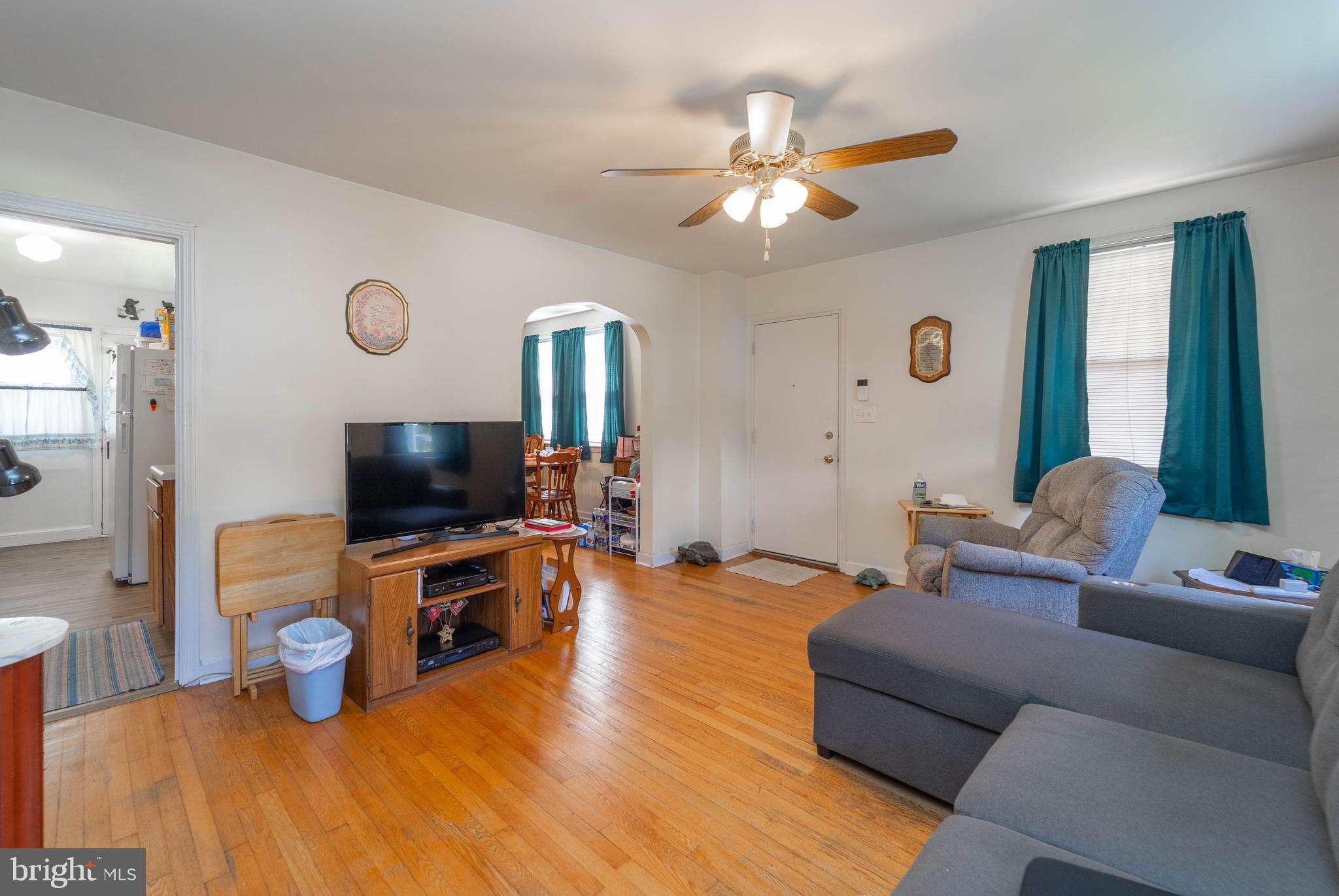 6515 Frederick Road Catonsville, MD 21228 - Photo 13 of 30 a living room with furniture and a flat screen tv
