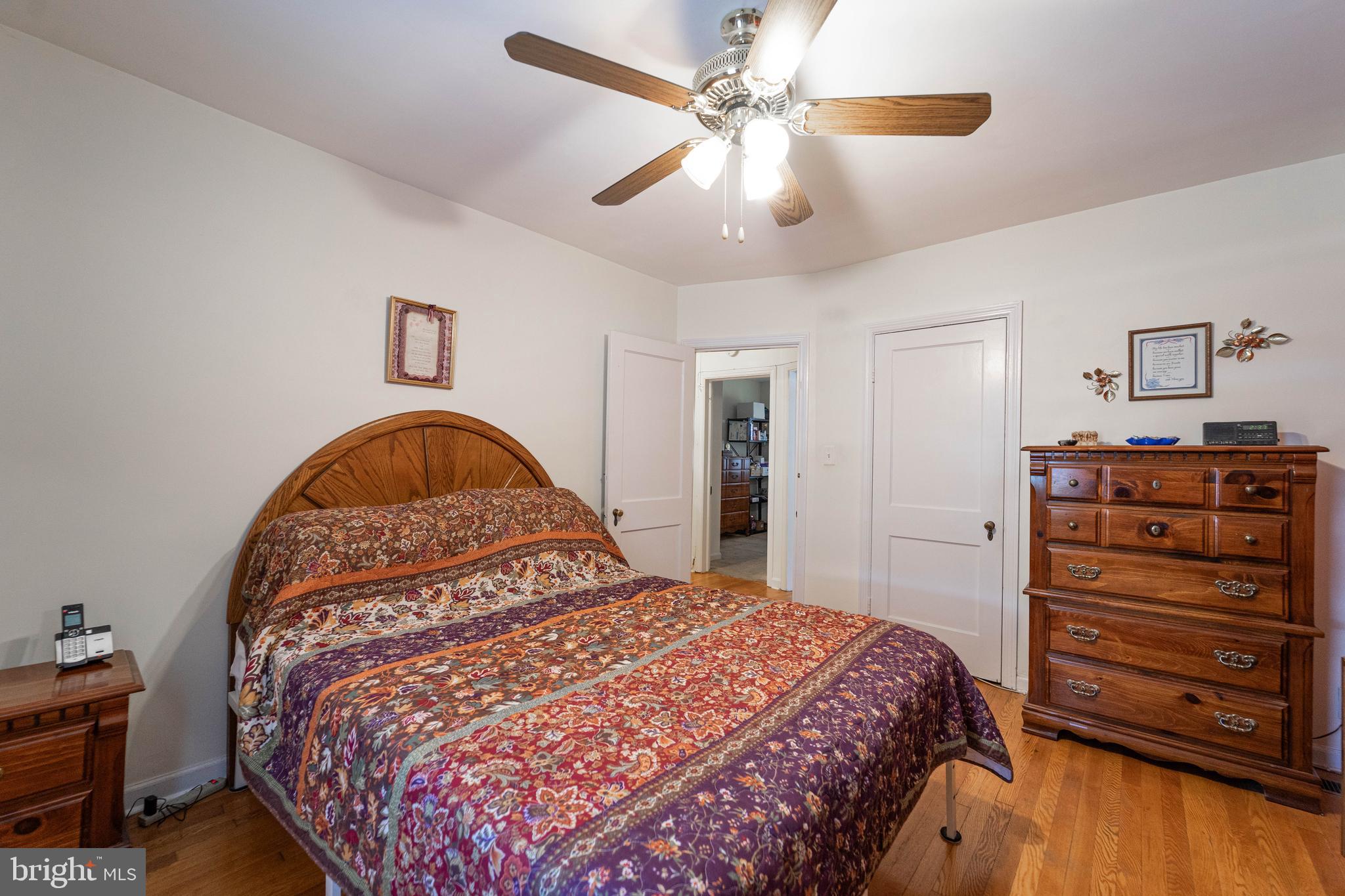 6515 Frederick Road Catonsville, MD 21228 - Photo 10 of 30 a bedroom with a bed and a dresser