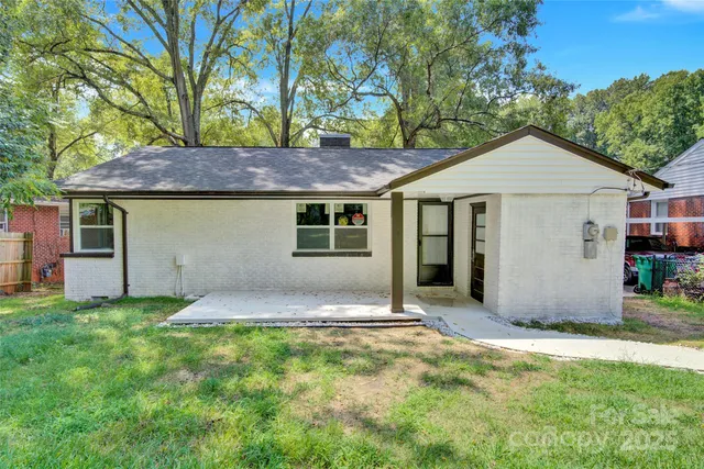 a house with trees in the background