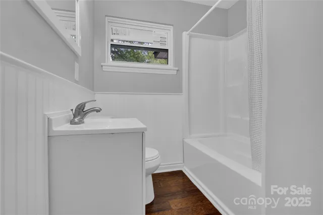 a bathroom with a bathtub and sink