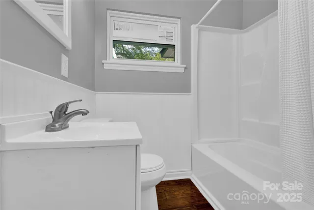 a bathroom with a sink toilet and bathtub