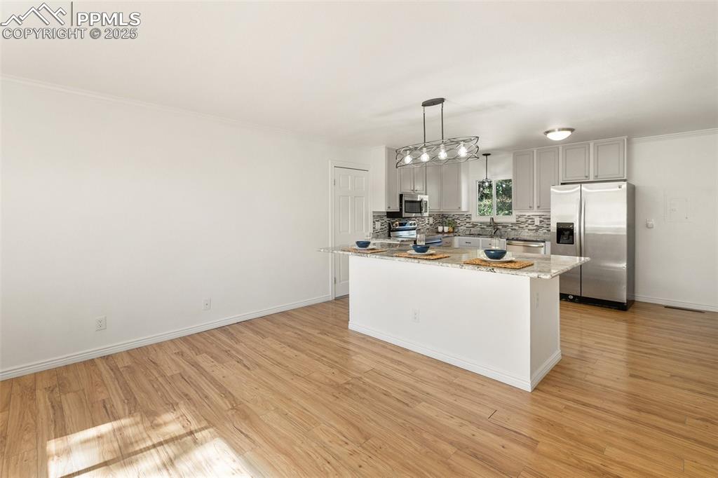 2518 Royalty Court Colorado Springs, CO 80904 - Photo 20 of 47 a view of kitchen with refrigerator sink and cabinets