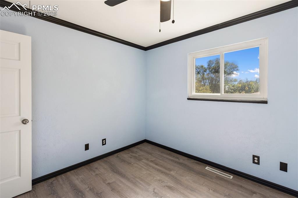 2518 Royalty Court Colorado Springs, CO 80904 - Photo 39 of 47 a view of an empty room with a window