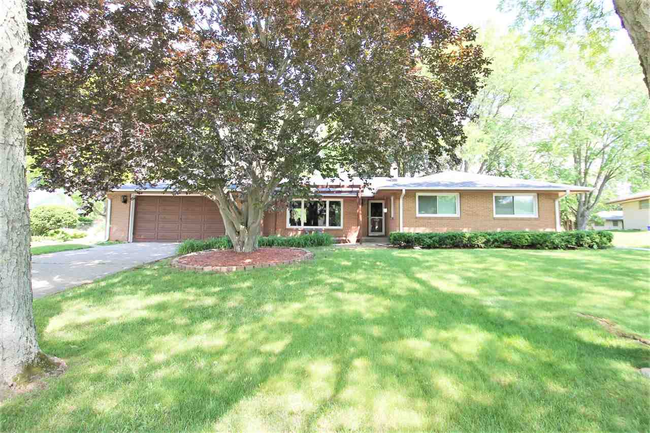 4118 Landstrom Road Rockford, IL 61114 - Photo 1 of 24 a front view of a house with a yard and trees