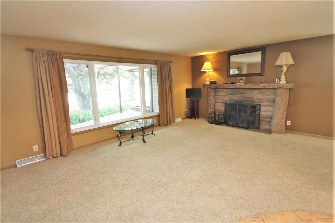 4118 Landstrom Road Rockford, IL 61114 - Photo 16 of 24 a view of an empty room with a fireplace and a window