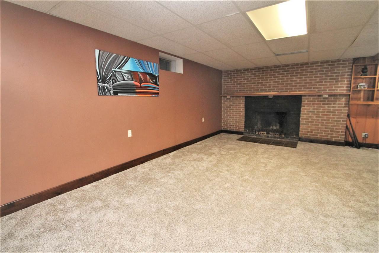 4118 Landstrom Road Rockford, IL 61114 - Photo 24 of 24 a view of an empty room with a fireplace