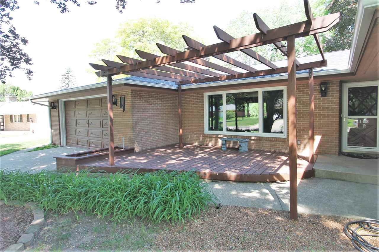 4118 Landstrom Road Rockford, IL 61114 - Photo 3 of 24 a backyard of a house with table and chairs