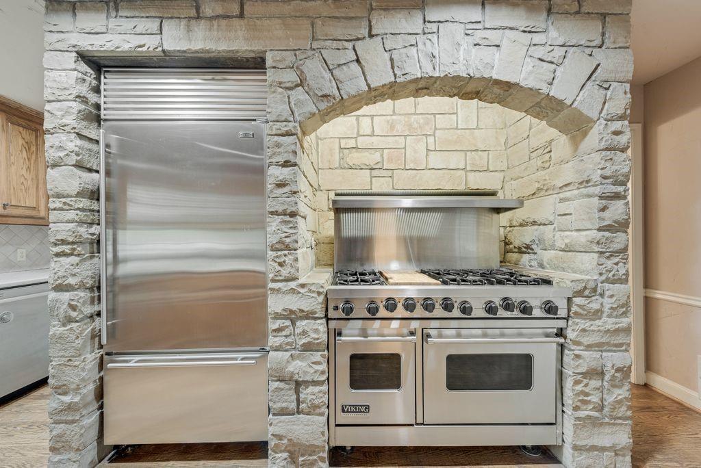 2 Eastshore Road Heath, TX 75032 - Photo 23 of 30 a stove top oven sitting inside of a kitchen