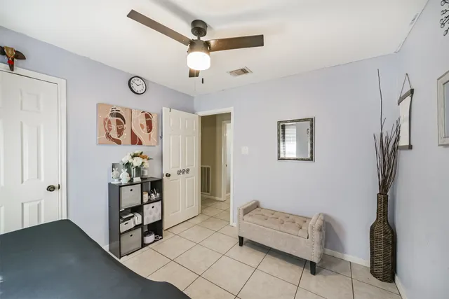 a view of room with furniture and fan