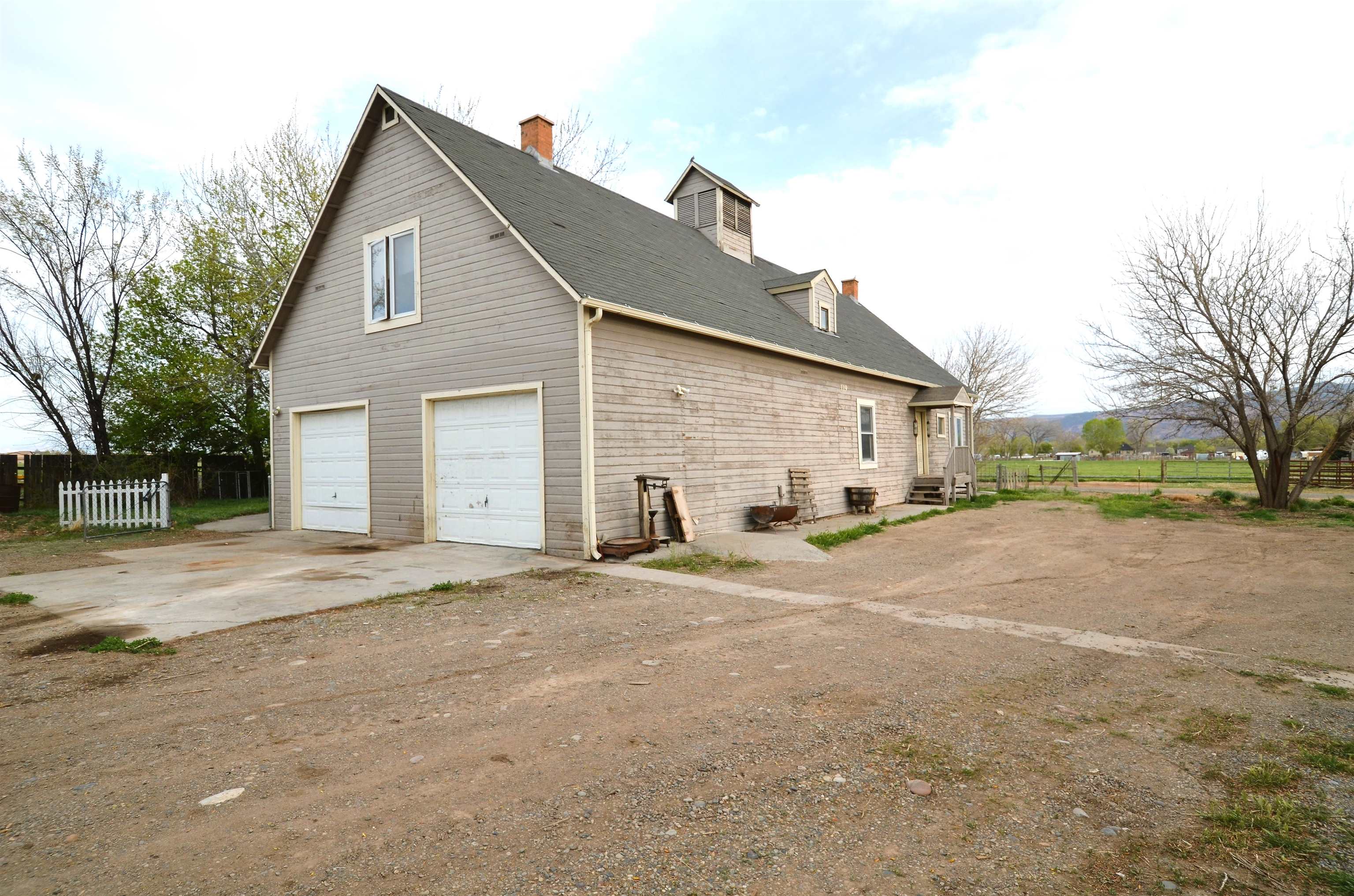 1194-17 17 1/2 Road Fruita, CO 81521 - Photo 3 of 42 a view of a house with a yard and garage