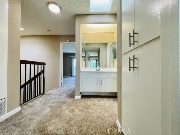 a view of a hallway with entryway door