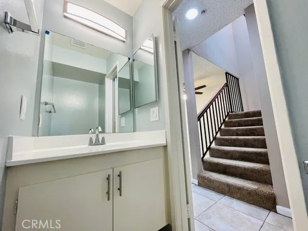 a bathroom with a sink and mirror