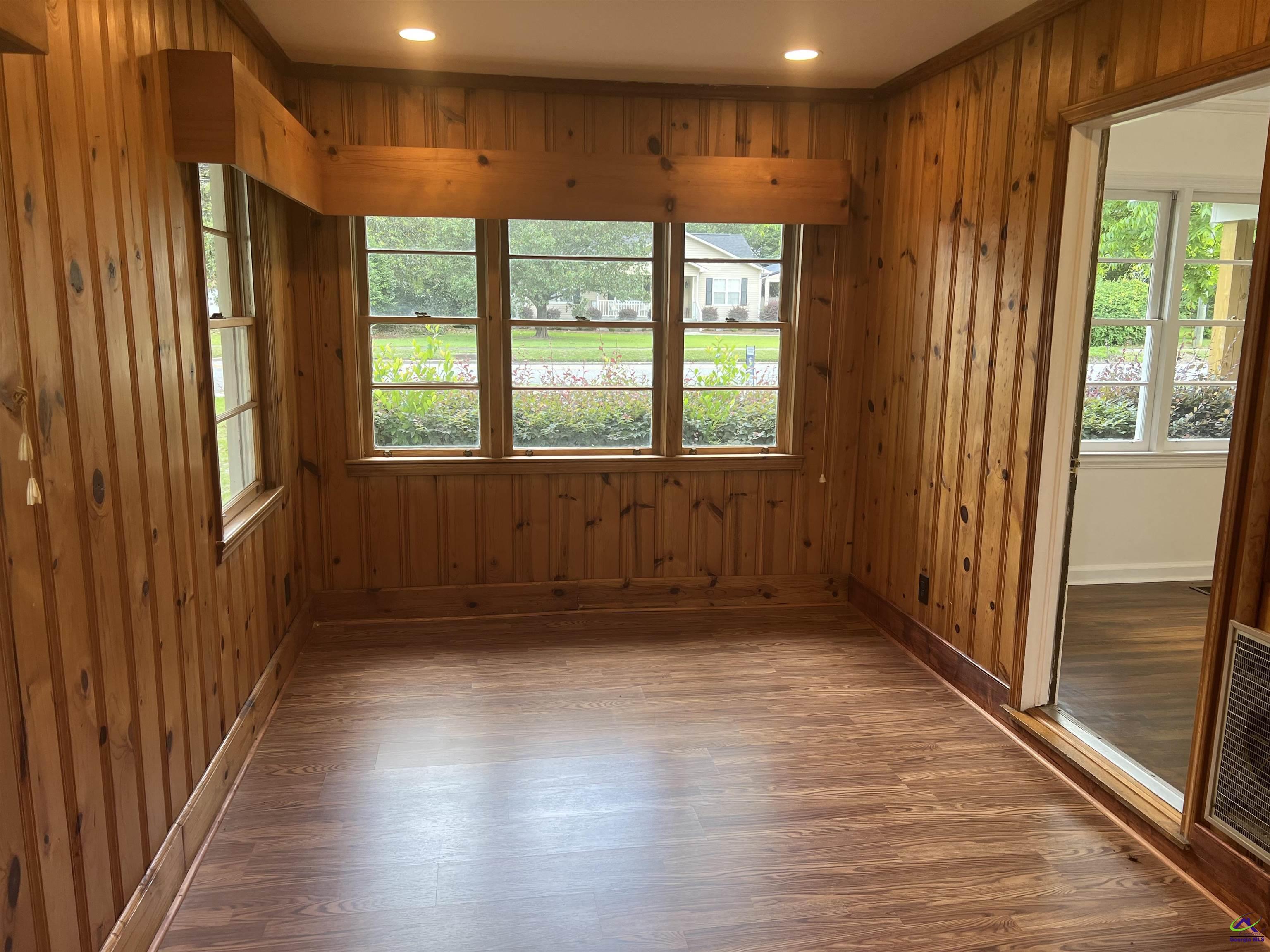 145 South 2nd Street Cochran, GA 31014 - Photo 6 of 24 a view of hallway with a large window and wooden floor
