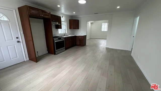 a kitchen with stainless steel appliances a refrigerator and a sink