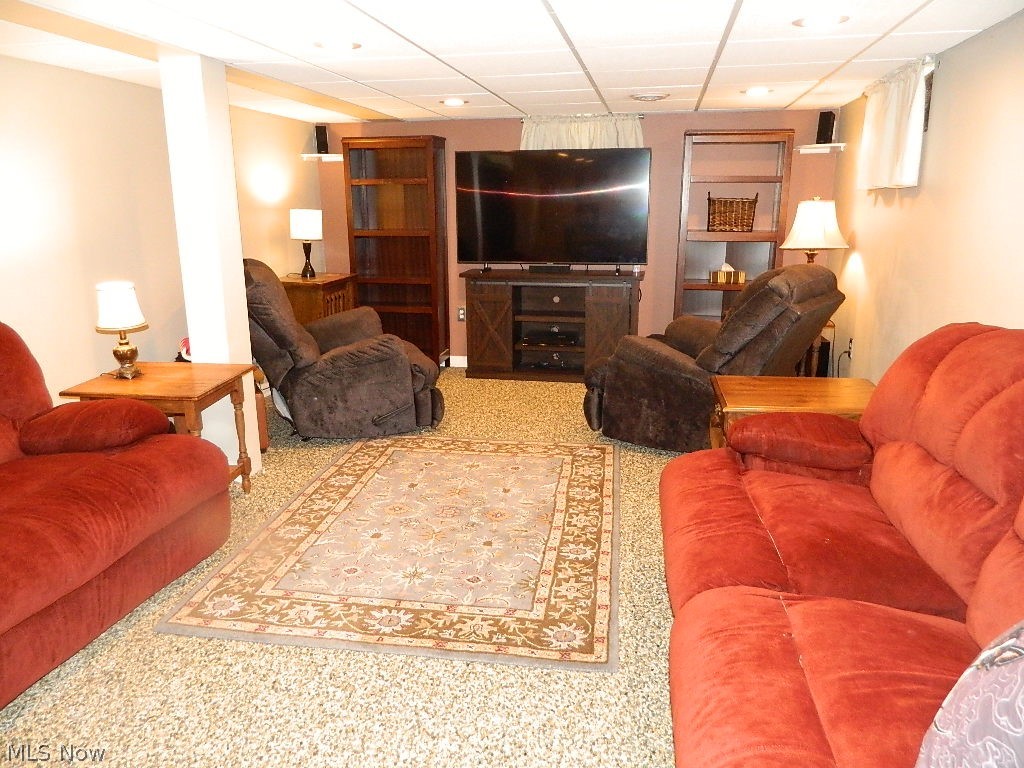 1604 Lyndhurst Road Lyndhurst, OH 44124 - Photo 23 of 35 Entertaining Lower Level Family Room Boasts Nature Store Flooring, Glass Block Windows and ...