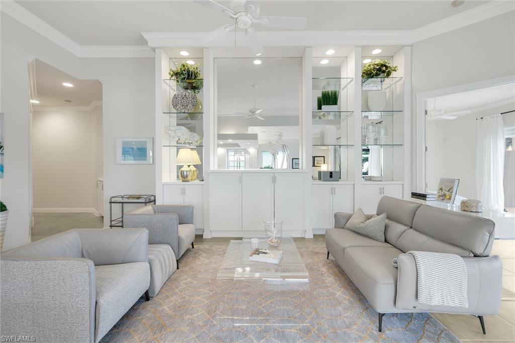 7063 Toscana Court Naples, FL 34114 - Photo 11 of 47 Living area featuring crown molding, recessed lighting, and a ceiling fan