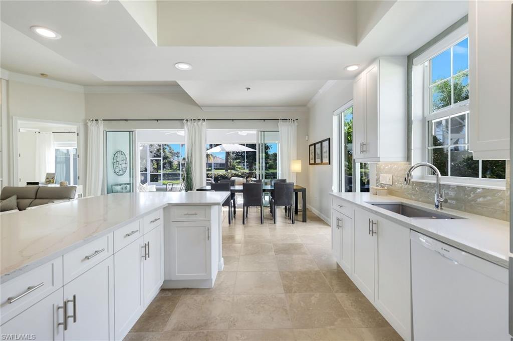7063 Toscana Court Naples, FL 34114 - Photo 47 of 47 Kitchen featuring dishwasher, white cabinets, open floor plan, plenty of natural light, and recessed lighting