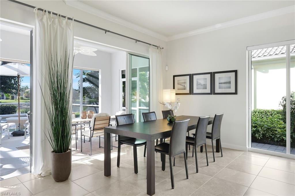 7063 Toscana Court Naples, FL 34114 - Photo 16 of 47 Dining space featuring ornamental molding and light tile patterned flooring