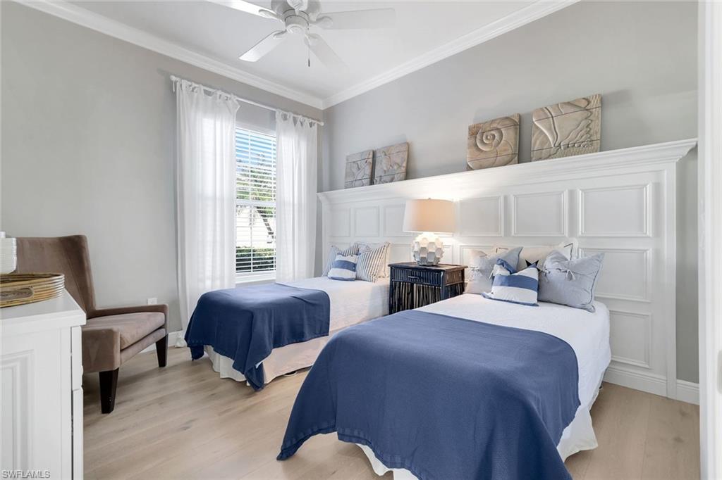7063 Toscana Court Naples, FL 34114 - Photo 25 of 47 Bedroom with crown molding, light wood-type flooring, and ceiling fan