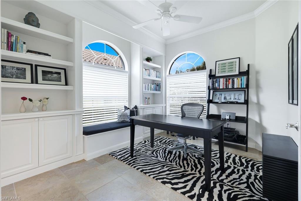 7063 Toscana Court Naples, FL 34114 - Photo 29 of 47 Office featuring built in shelves, a ceiling fan, ornamental molding, and plenty of natural light
