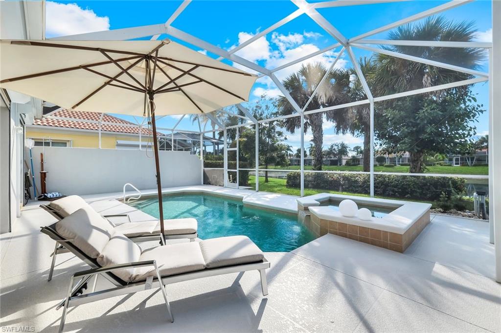 7063 Toscana Court Naples, FL 34114 - Photo 34 of 47 View of swimming pool with a sunroom, a patio area, a lanai, and a pool with connected hot tub