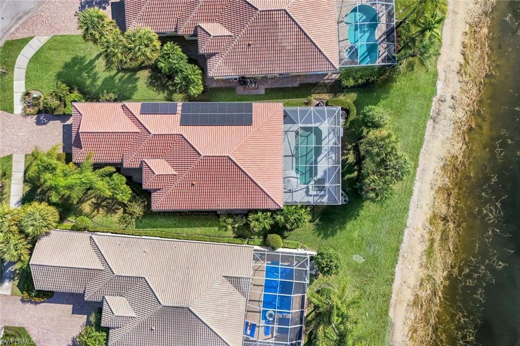 7063 Toscana Court Naples, FL 34114 - Photo 46 of 47 Aerial view of a pool