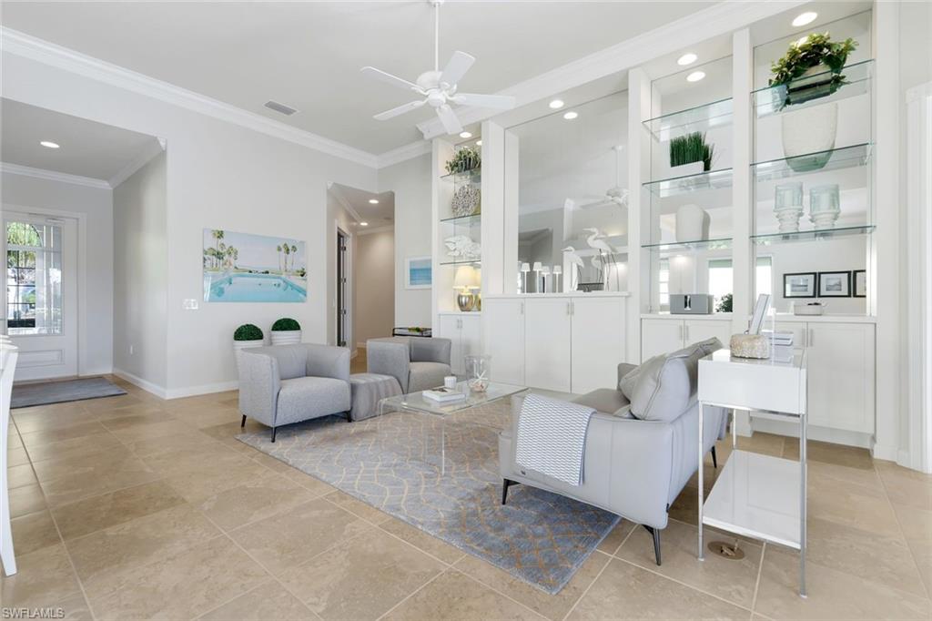7063 Toscana Court Naples, FL 34114 - Photo 8 of 47 Living area featuring crown molding, a ceiling fan, and recessed lighting