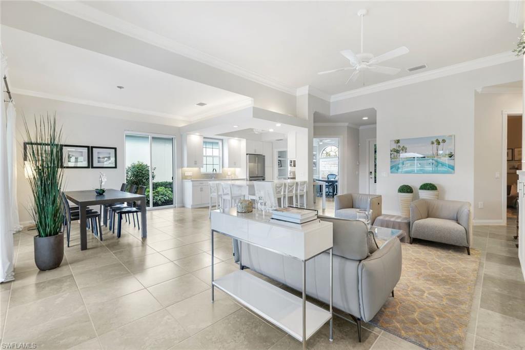 7063 Toscana Court Naples, FL 34114 - Photo 10 of 47 Living area with ornamental molding, ceiling fan, light tile patterned floors, and recessed lighting