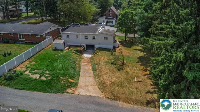an aerial view of residential house with outdoor space