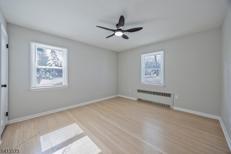 252 Knickerbocker Road Closter, NJ 07624 - Photo 11 of 27 a view of an empty room with a window