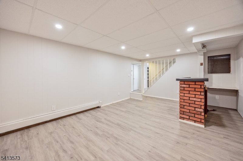 252 Knickerbocker Road Closter, NJ 07624 - Photo 16 of 27 an empty room with wooden floor and windows