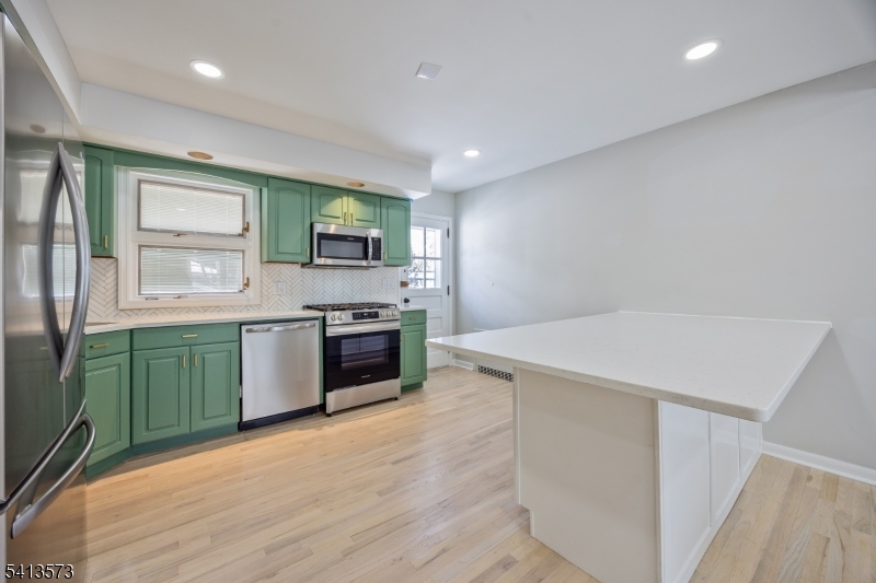 252 Knickerbocker Road Closter, NJ 07624 - Photo 4 of 27 a large kitchen with a stove a sink dishwasher and a refrigerator