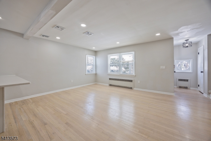 252 Knickerbocker Road Closter, NJ 07624 - Photo 7 of 27 an empty room with windows and cabinet