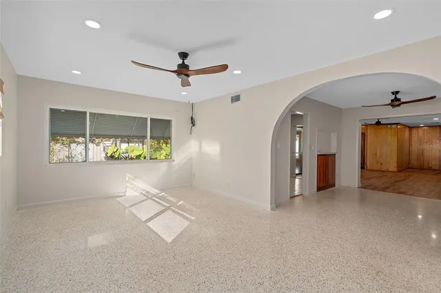 a kitchen with stainless steel appliances a refrigerator sink and cabinets