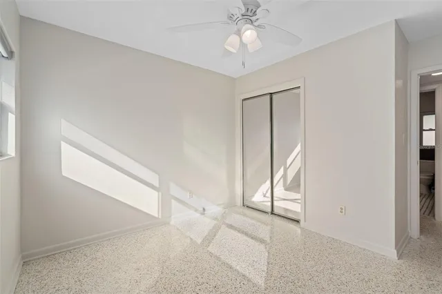 a view of room with window and ceiling fan