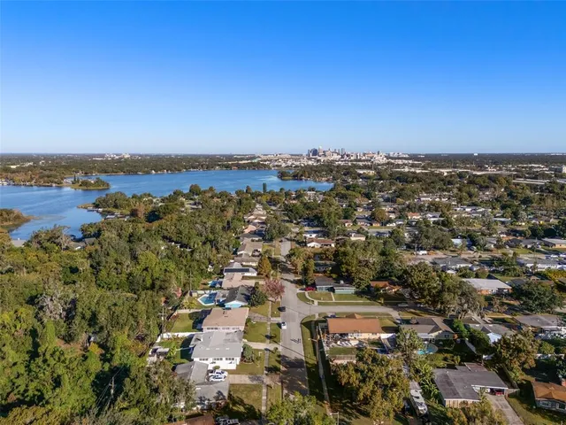 an aerial view of a house with a swimming pool
