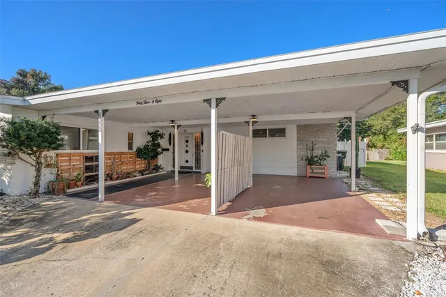 a view of a house with porch and furniture