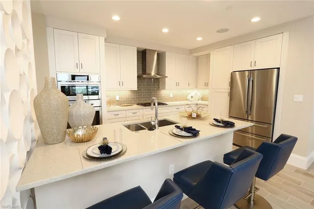 a kitchen with a dining table and chairs