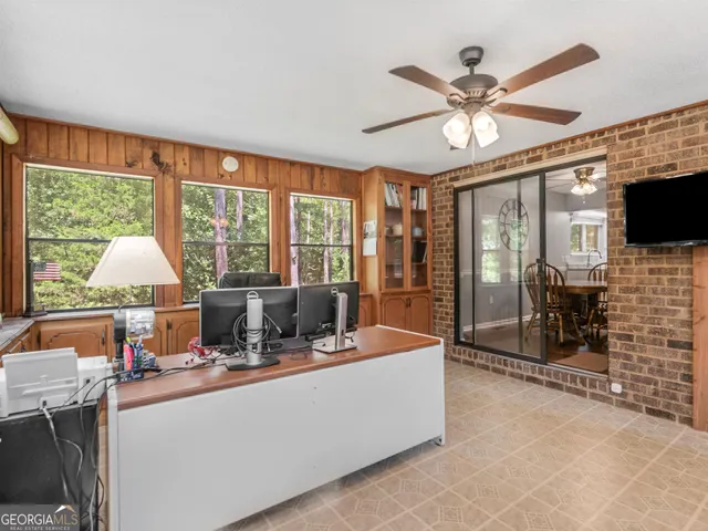 a living room with fireplace furniture and a flat screen tv