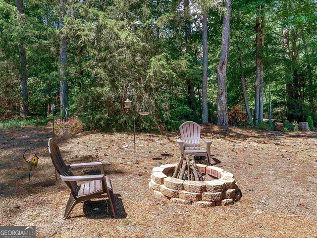 a view of a backyard with furniture