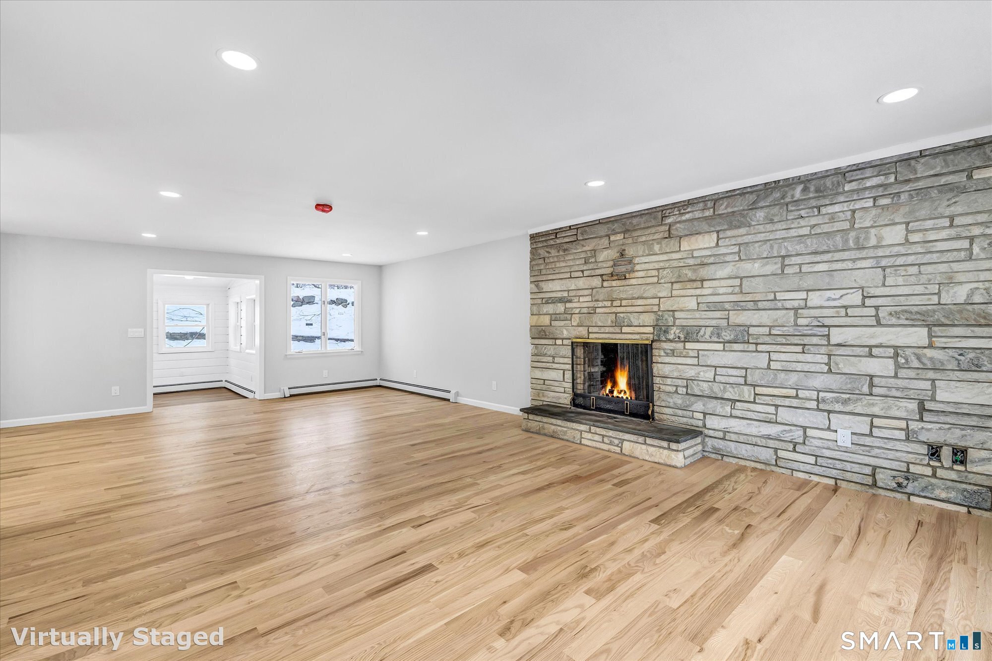 176 Strobel Road Trumbull, CT 06611 - Photo 11 of 39 a view of empty room with wooden floor and fireplace
