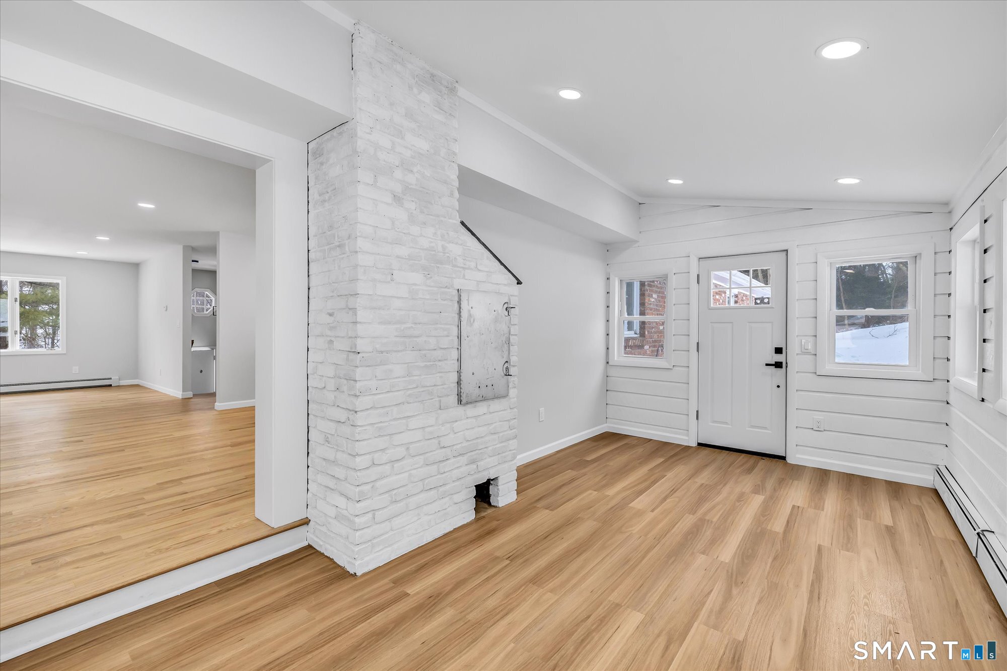 176 Strobel Road Trumbull, CT 06611 - Photo 16 of 39 a view of an empty room with wooden floor and a window