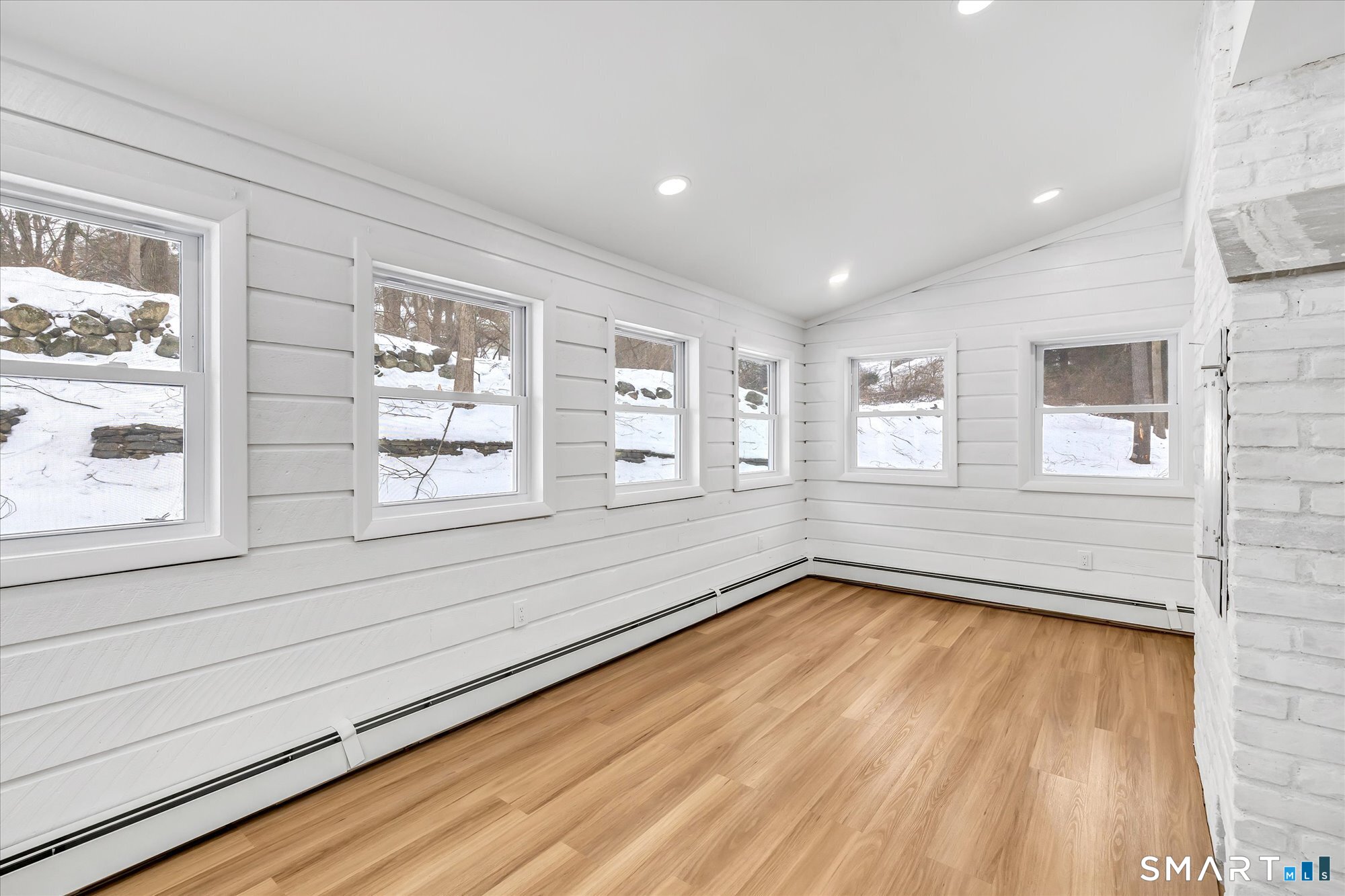 176 Strobel Road Trumbull, CT 06611 - Photo 18 of 39 a view of an empty room with a window and wooden floor
