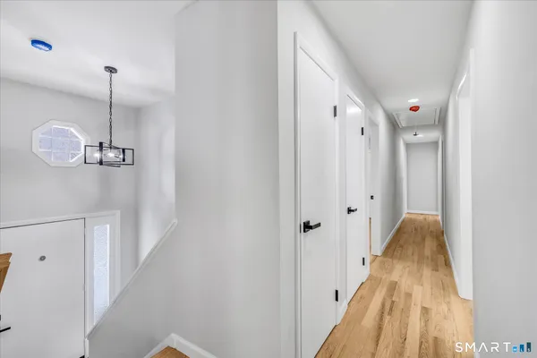 a view of a hallway view with staircase