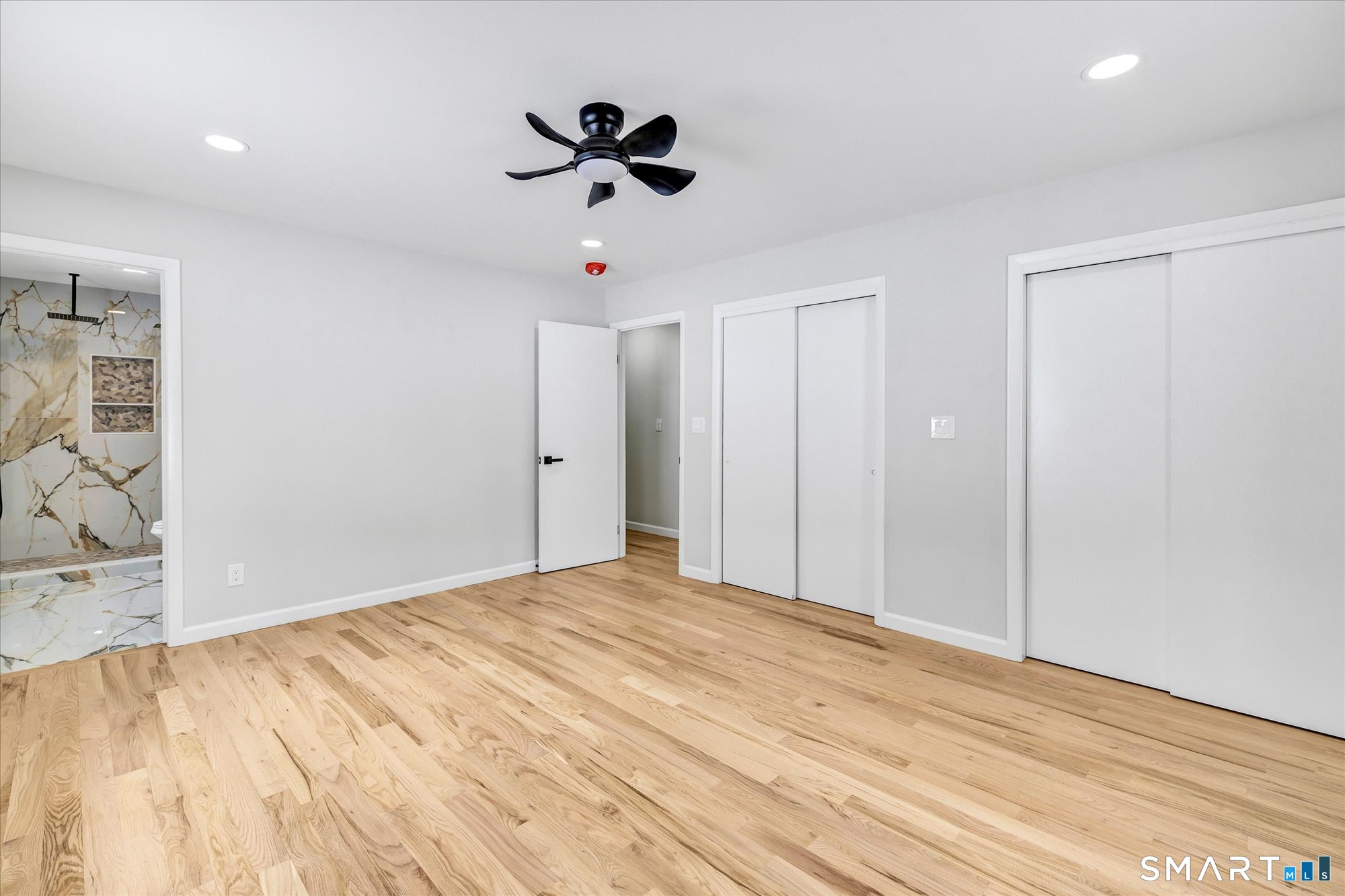 176 Strobel Road Trumbull, CT 06611 - Photo 21 of 39 a view of empty room with wooden floor and ceiling fan