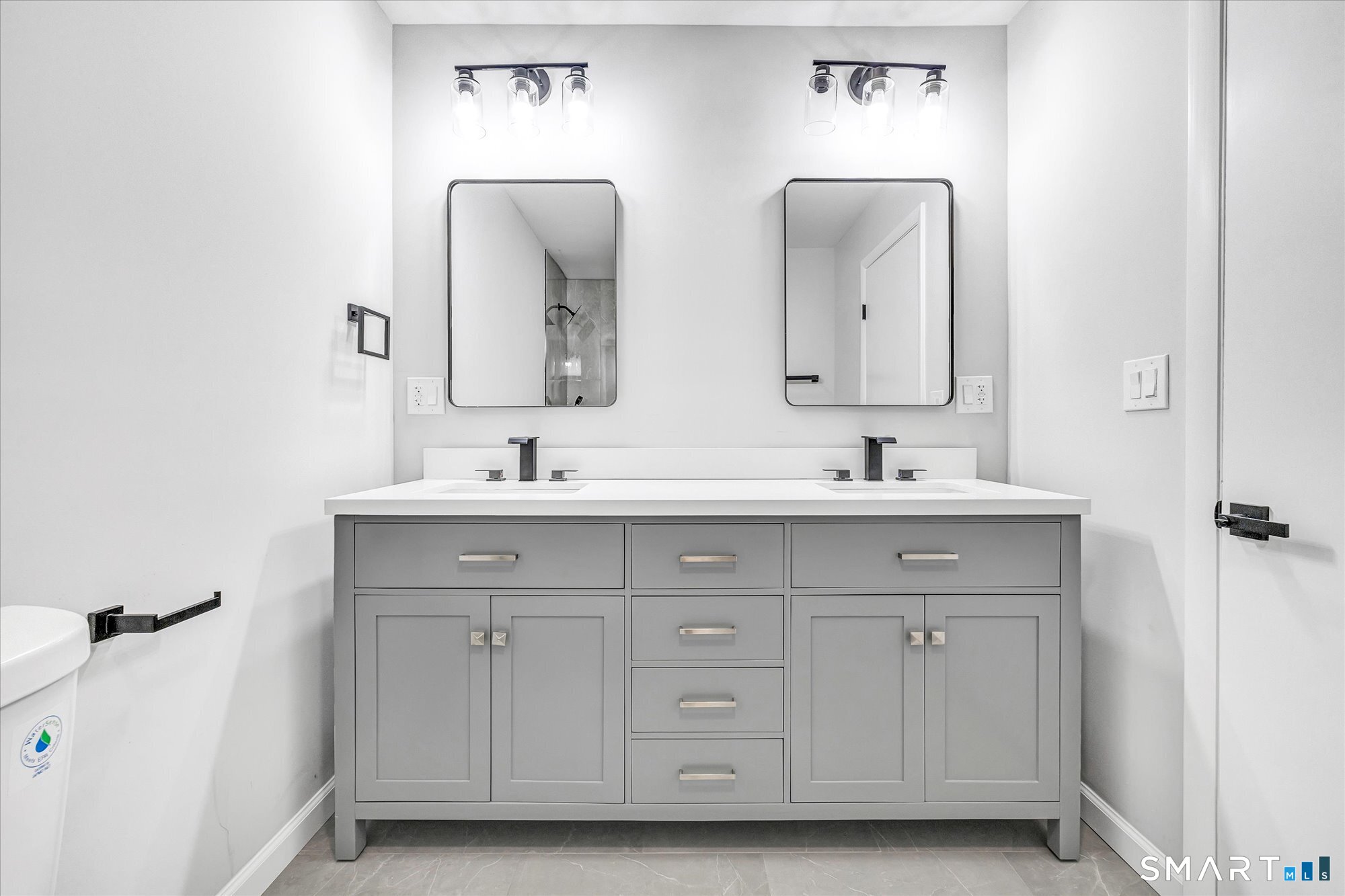 176 Strobel Road Trumbull, CT 06611 - Photo 26 of 39 a bathroom with a double vanity sink and mirror