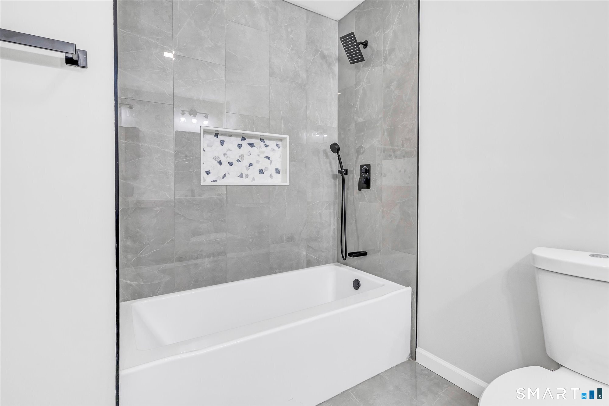 176 Strobel Road Trumbull, CT 06611 - Photo 27 of 39 a bathroom with a bathtub and a toilet