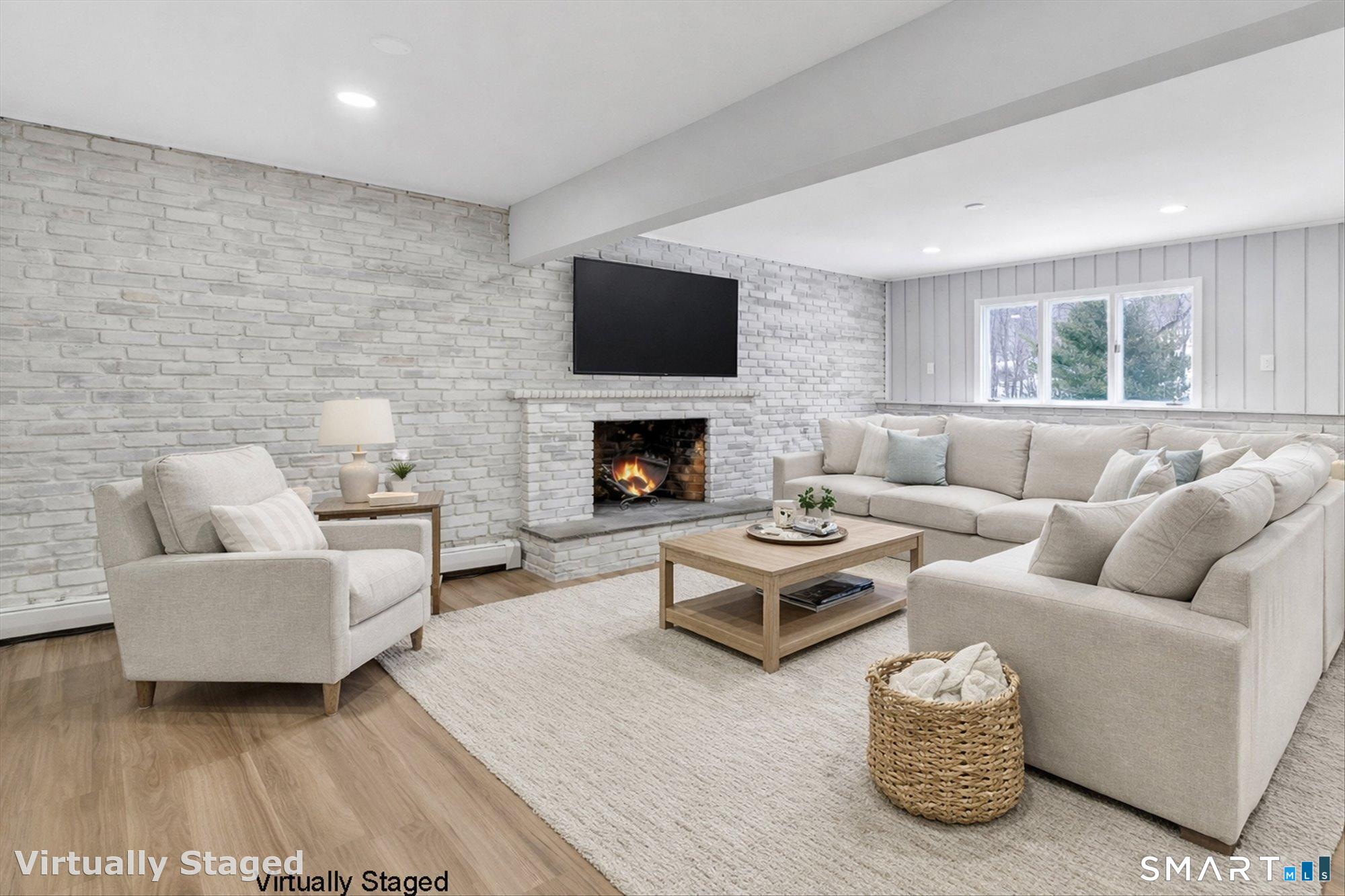 176 Strobel Road Trumbull, CT 06611 - Photo 29 of 39 a living room with furniture and a fireplace